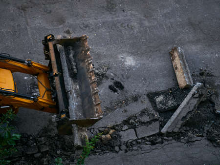 Buldozer Making and constructing a new asphalt road near the civil building. Concepts of improvement of the territory of buildings.のeditorial素材