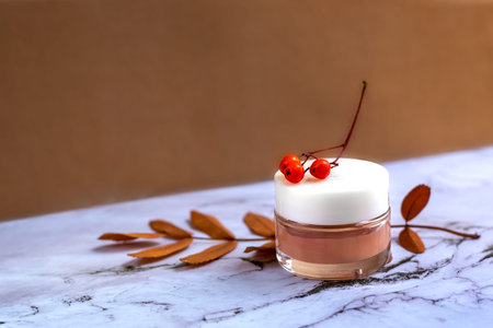 Composition with a jar of natural cream (cleansing mask made of clay) on a light marble background...
