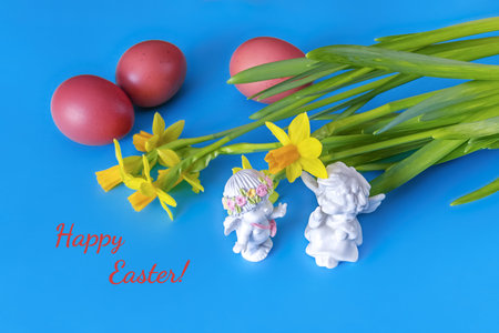 Easter card with red eggs, narcissus flowers and two angels communicating. blue color. Happy Easter....