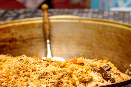Uzbek pilaf in large cauldron close-up.の写真素材