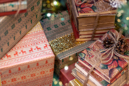 Gifts and books under Christmas tree. Boxing Day.
