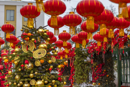 City street is decorated with red lanterns and large coins to celebrate Chinese New Yearの写真素材