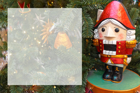 Nutcracker on Christmas tree. Copy space, blank letterhead for text and announcements