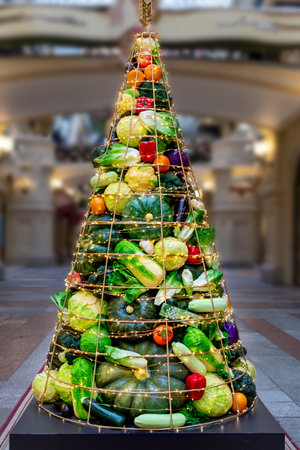 Creative Christmas tree made of fruits and vegetables. Healthy foodの写真素材