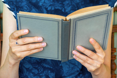 Woman's hands with book close-up. Book lovers, lovers of reading. Book Day.