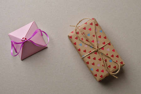 Valentine's day gift boxes on a cardboard beige background with space for your creativity and space for text.の写真素材