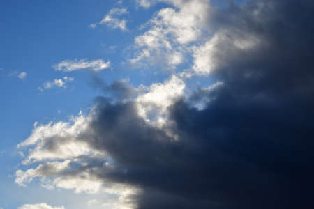 Landscape with dramatic clouds against a blue sky.の写真素材
