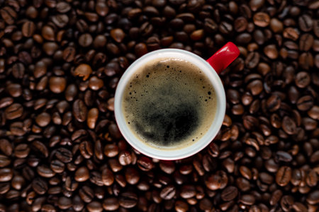 Coffee cup and coffee beans background. Top view with copy space.の写真素材