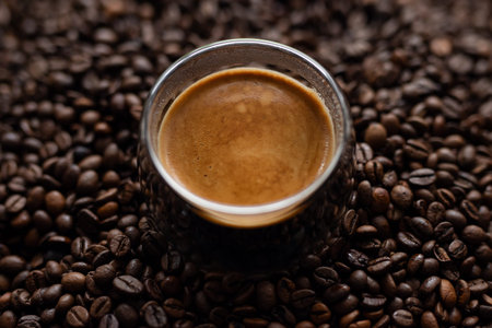 Coffee cup and coffee beans on a dark background. Close up.の写真素材
