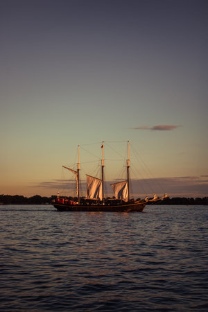 Sailing ship on Lake Ontario at sunset, Canada.の写真素材