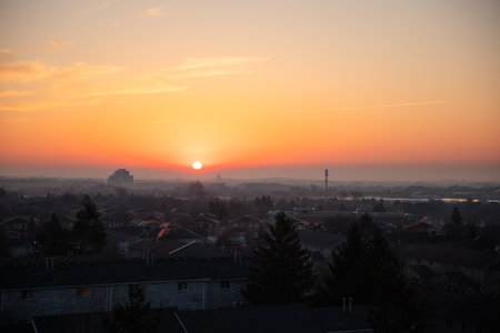 Sunset over the city on a foggy winter day, Canada.の写真素材