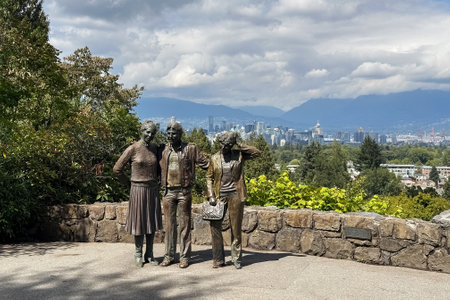 Sculpture of a man and a woman in the park. View of the city of Vancouver from Botanical Garden, BC.の写真素材