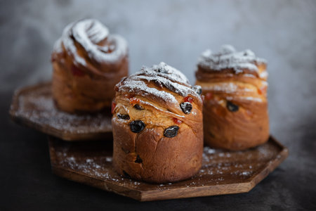 Paska cruffin with candied fruit on a dark background. Easter holiday.