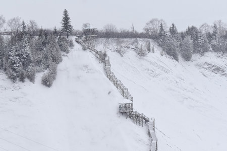 Winter landscape with snow-covered trees and ski slopes. Quebec, Canada.の写真素材