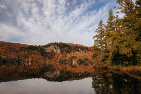 Autumn landscape with a lake in the mountains. Reflection in water. Quebec, Canada.の写真素材