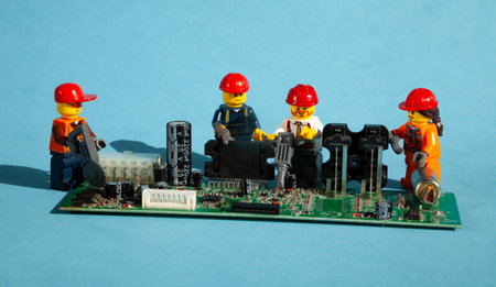 Ukraine, Kyiv - April 6, 2020: Computer repair LEGO men. Workers and engineers. Repairmen and...