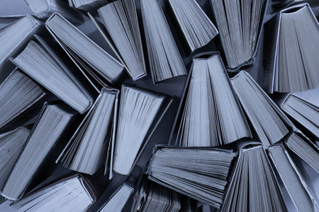 Book background. Old books in the library. Bookshelf shop. Knowledge publications, literature. Bookish bookstore, bookshop. Flatlay top view.の写真素材