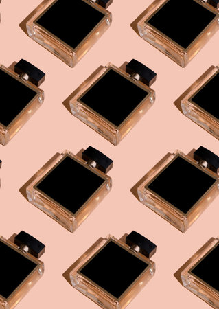 Fragnance parfume pattern. Bottles of black perfume on a pastel background, flat lay, top view. Mockup of fragrance perfume. Trendy sunlight minimal concept sadow. Perfume bottle with place for text.の写真素材