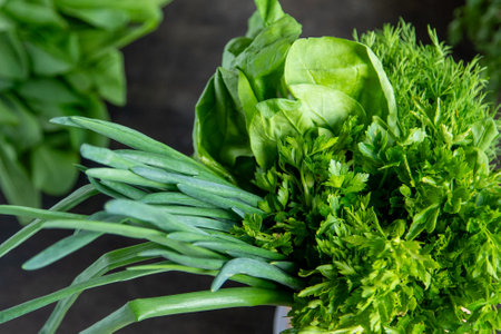 Green onions, spinach, parsley and dill. Vitamin food. Prepare greens for salad.の写真素材