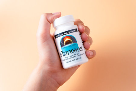 L-tryptophan source naturals Vitamins from iHerb to hold in hand. Biologically active food additives. Dietary supplement set buy online.のeditorial素材