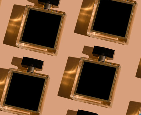 Fragnance parfume pattern. Bottles of black perfume on a pastel background, flat lay, top view. Mockup of fragrance perfume. Trendy sunlight minimal concept sadow.の写真素材