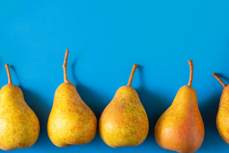 Pears on a wooden background. Fruit harvest. Autumn still life. Pear variety Bera Conference.の写真素材