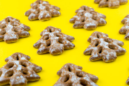 Christmas tree cookies on wooden background. New Year's food. Festive baked goods. Gingerbread on...