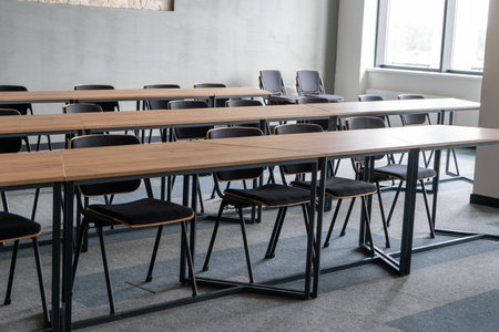 Empty room with tables and chairs for studying. University or school auditorium. Furniture in the interior. Modern style. Back to school. Studyの写真素材