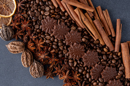 Food background. Coffee beans, cinnamon sticks, anise stars and chocolate candies.の写真素材