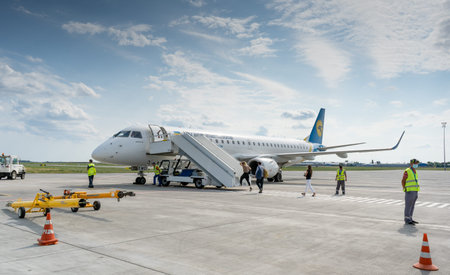 Odesa airport await departure. The plane Embraer 190 Ukraine International Airlines UIA. Passengers...