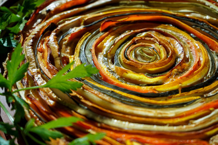 Vegetable zucchini, eggplant and carrots pie. Healthy summer food. Spiral tart with eggplantsの写真素材