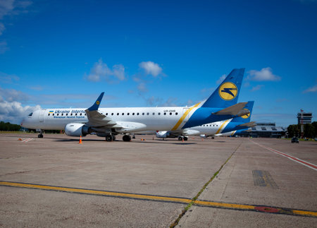 Ukrainian passenger plane UR-EMB Embraer ERJ-190 at the airport. Ukraine International Airlines UIA.