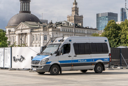 Police car on the street. Polish police patrol and order. City of Warsaw, Poland - July 26, 2023のeditorial素材