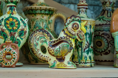 Clay rooster. Ukrainian traditional ceramics. Bird figurine. Kosiv painting.の写真素材