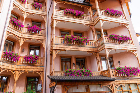 Petunia flowers on the balcony of a wooden house.の写真素材