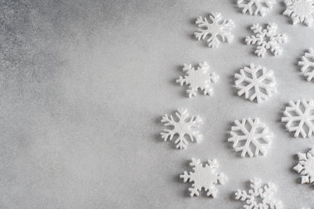 White snowflakes on a gray background.の写真素材