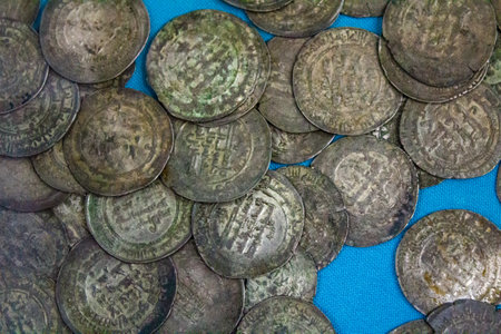 Treasure of metal detectors. Old coins. Vintage silver money. Retro coin.の写真素材