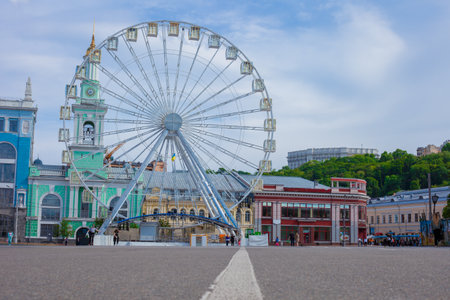 Ferris wheel in the city. Amusement park in the squareの写真素材