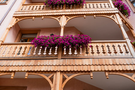 Flowers on the balcony of a wooden house.の写真素材