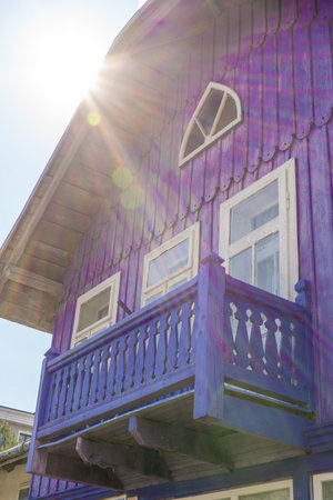 Wooden balcony of a wood house. Exterior facade. Blue colorの写真素材