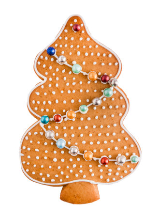 Gingerbread decorated with white sugar glaze isolated on white background. Christmas cookies.