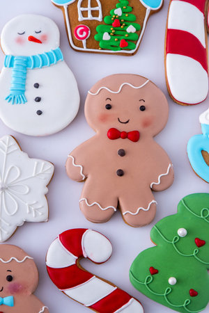 Gingerbread man decorated sugar glaze icing. Food background. Christmas cookies.