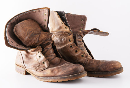 Old shoes on a white background. Leather brown shoe. Worn shoes.の写真素材