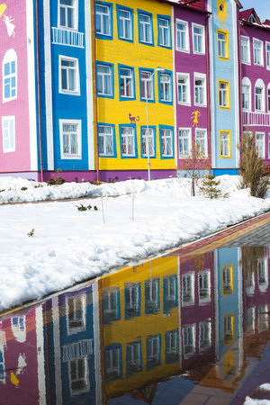 Colorful bright house. The building of the school and kindergarten. Architecture of Ukraine. Ukrainian village.の写真素材