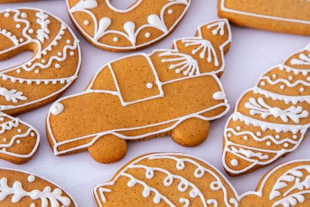 Gingerbread decorated with white sugar glaze. Food background. Christmas cookies.の写真素材