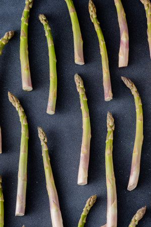 Green asparagus pattern on background. Vegetable sprouts stemsの写真素材