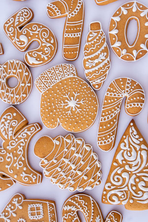 Gingerbread decorated with white sugar glaze. Food background. Christmas cookies.の写真素材