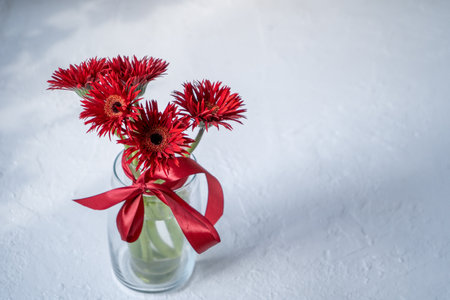 Gerbera Red Flowers in Glass Vaseの写真素材