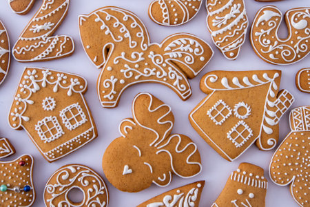 Gingerbread decorated with white sugar glaze. Food background. Christmas cookies.の写真素材
