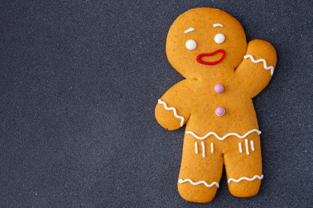 Gingerbread Man Cookie Figure decorated with icing sugar glaze. Food background. Christmas cookies.の写真素材